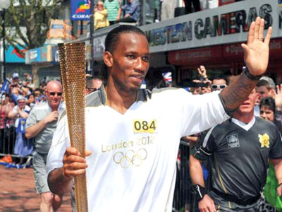 olympics drogba mobbed on torch relay leg