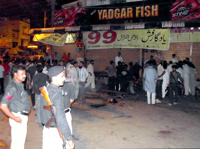 extortion and arrests cook killed 13 others injured in grenade attack