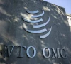 wto plans 10 budget cut as us falls back into arrears