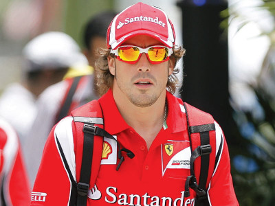 f1 alonso zooms past finish line