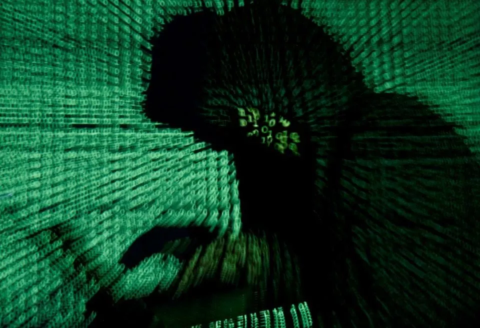a man holds a laptop computer as cyber code is projected on him in this illustration picture taken on may 13 2017 photo reuters file a man holds a laptop computer as cyber code is projected on him in this illustration picture taken on may 13 2017 photo reuters file