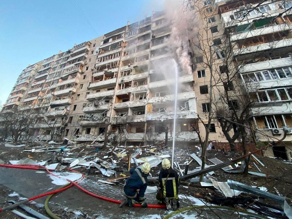 rescuers work next to a residential building damaged by shelling as russia s attack on ukraine continues in kyiv ukraine in this handout picture released march 15 2022 photo reuters