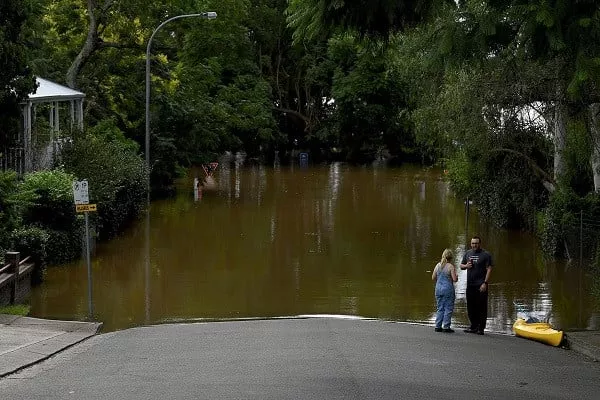 people look on as residential properties and roads are submerged under floodwater in windsor north west of sydney australia march 9 2022 photo reuters people look on as residential properties and roads are submerged under floodwater in windsor north west of sydney australia march 9 2022 photo reuters