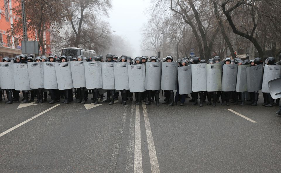 kazakh law enforcement officers block a street during a protest triggered by fuel price increase in almaty kazakhstan january 5 2022 reuters