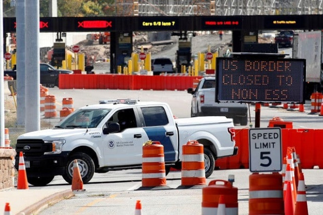 a u s customs and protection vehicle stands beside a sign reading that the border is closed to non essential traffic at the canada united states border crossing at the thousand islands bridge to combat the spread of the coronavirus disease in ontario photo reuters a u s customs and protection vehicle stands beside a sign reading that the border is closed to non essential traffic at the canada united states border crossing at the thousand islands bridge to combat the spread of the coronavirus disease in ontario photo reuters
