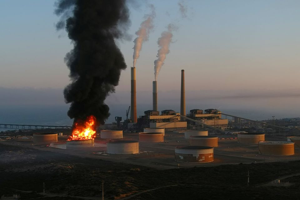 A large fire is seen near the scene of what officials said was a Gaza rocket attack on an Israeli energy pipeline near Ashkelon, Israel May 12, 2021. PHOTO: REUTERS