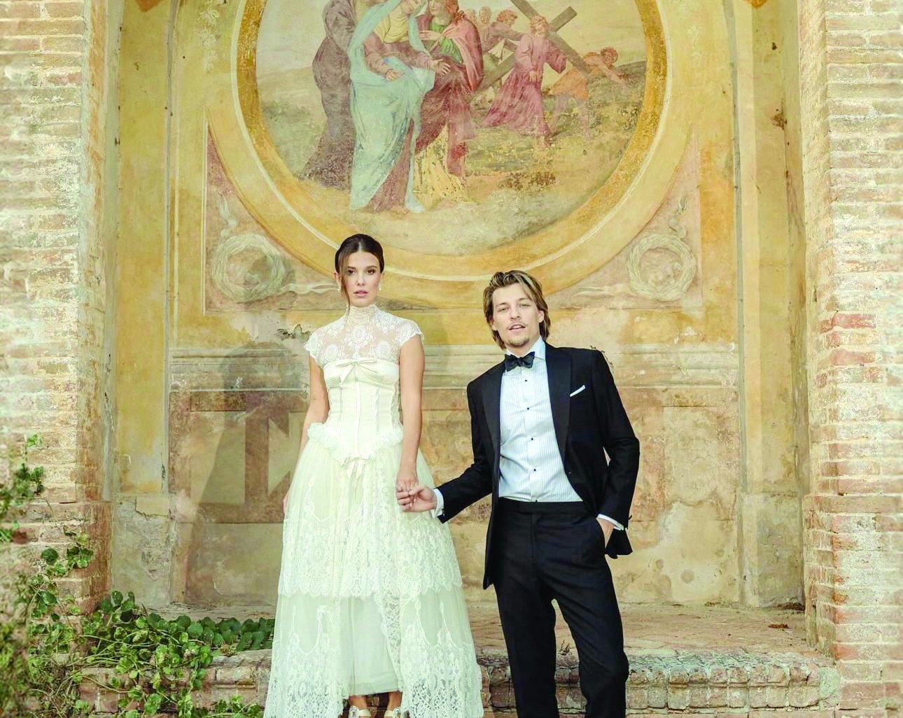 the couple posed for look two out of three underneath an italian fresco photo instagram