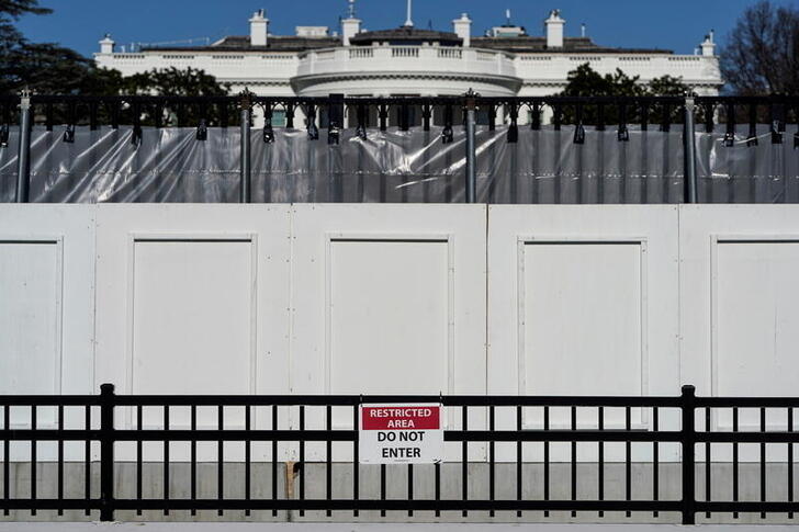 the white house is seen behind security fencing days after supporters of us president donald trump stormed the us capitol in washington us january 10 2021 reuters