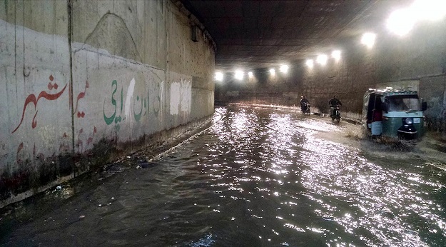 Stagnant rainwater at Sohrab Goth underpass in Karachi. PHOTO: Syed Asif Ali