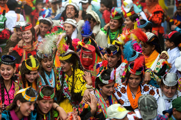 In this picture taken on May 16, 2019, Kalash women wearing traditional dresses dance as they celebrate 'Joshi', a festival to welcome the arrival of spring, at Bumburate village in the mountainous valleys in northern Pakistan. PHOTO: AFP