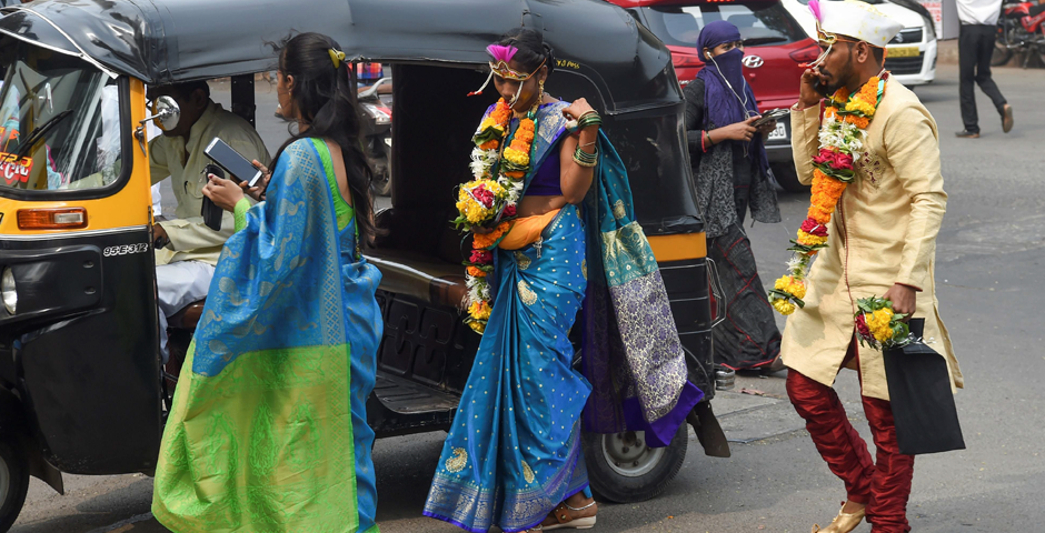 A bride and groom arrive at a marriage hall in Mumbai. Photo: AFP