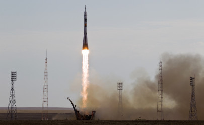 three astronauts blast off for iss on russian rocket