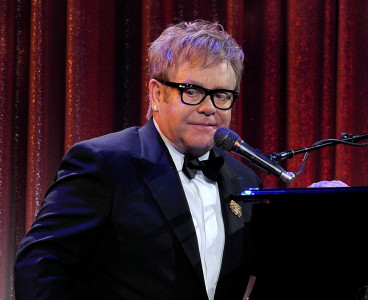 cure aids with love says elton john