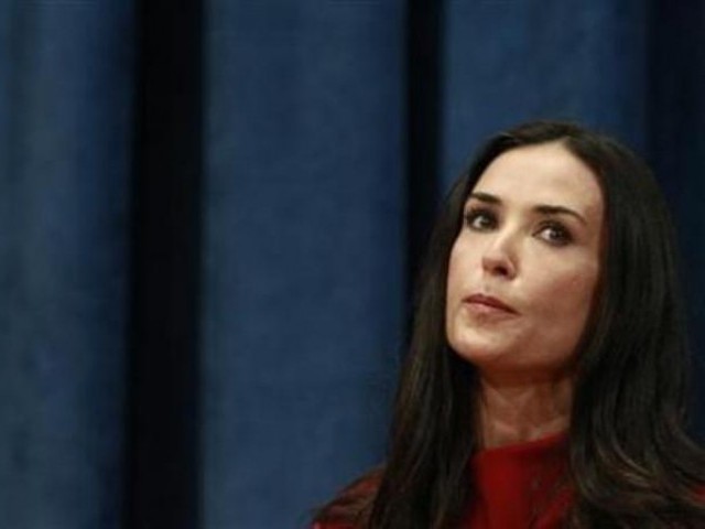 Henderson is 12 years younger to Moore. PHOTO: REUTERS