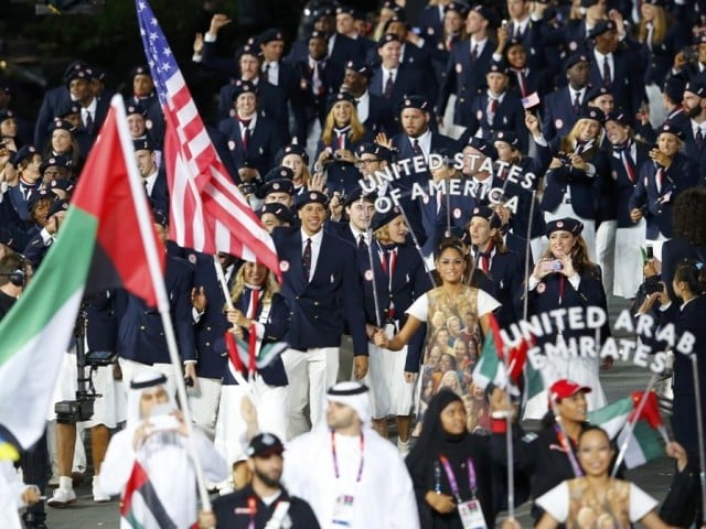 Members of the U.S. and the UAE contingent take part in the athletes parade during the opening ceremony of the London 2012 Olympic Games at the Olympic Stadium July 27, 2012.   PHOTO: REUTERS