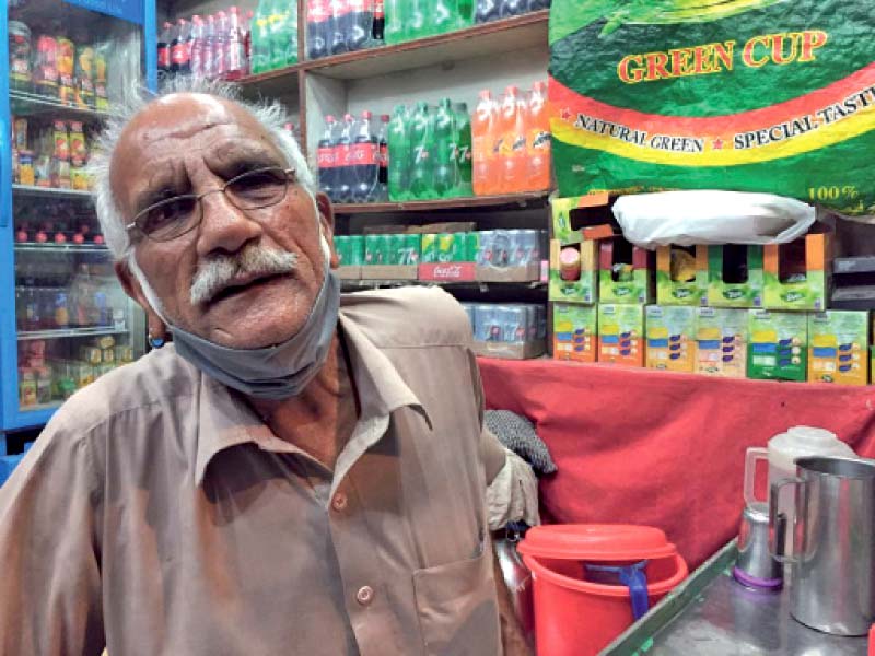 anwar hussain qureshi poses in his store photo express