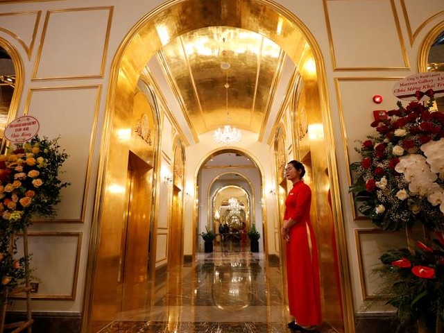 an employee in traditional dress is seen in the newly inaugurated dolce hanoi golden lake luxury hotel which features gold plated exteriors and interiors in hanoi vietnam photo reuters