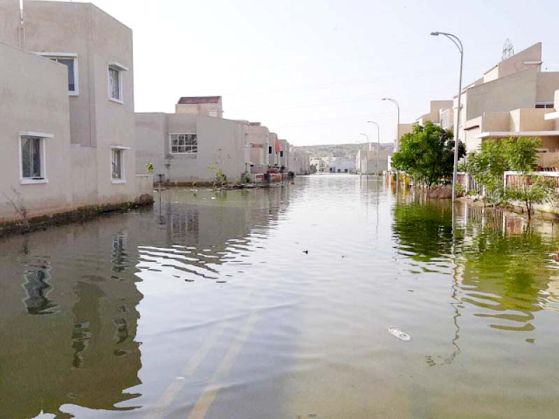 days after rain battered karachi naya nazimabad a newly developed residential society remains submerged in knee deep water as a result over 400 families have had to relocate to safer abodes photo express