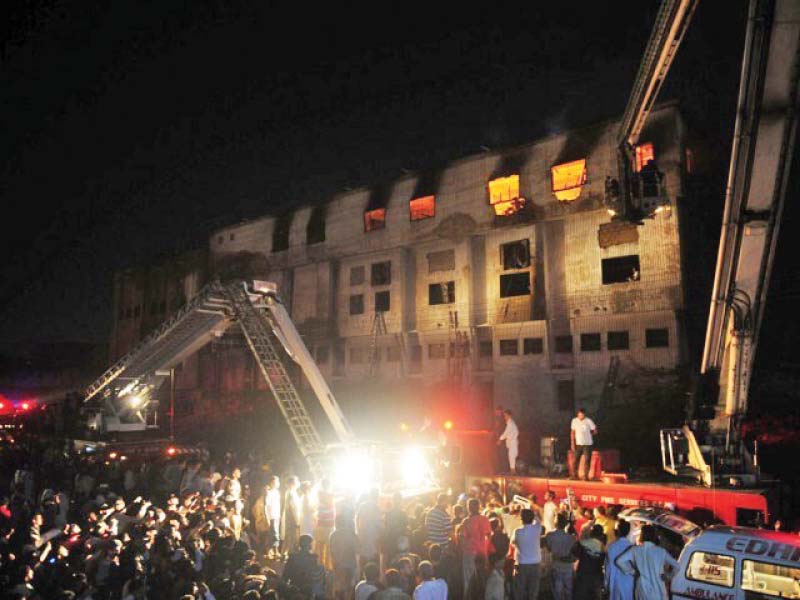 the factory fire left at least 260 workers dead eight years later their families await justice photo file