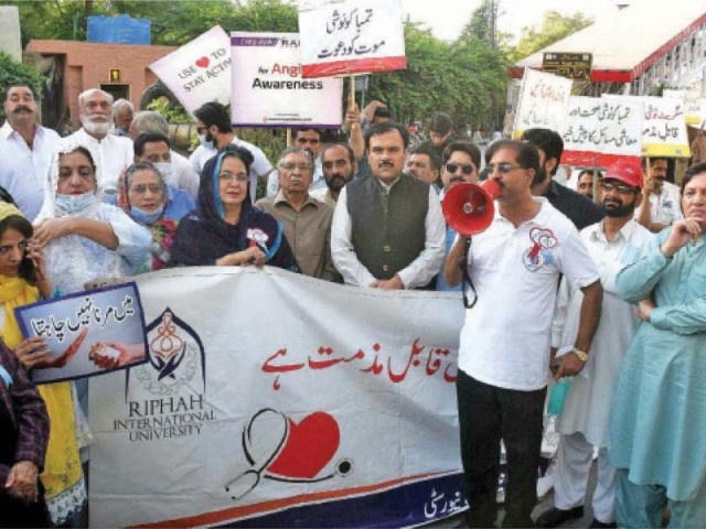 healthcare providers public representatives and members of civil society take part in a walk held to mark world heart day in rawalpindi on tuesday photo express healthcare providers public representatives and members of civil society take part in a walk held to mark world heart day in rawalpindi on tuesday photo express