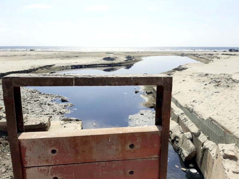 nullahs have been opened up onto sea view beach creating streams of murky water on the sand photo express