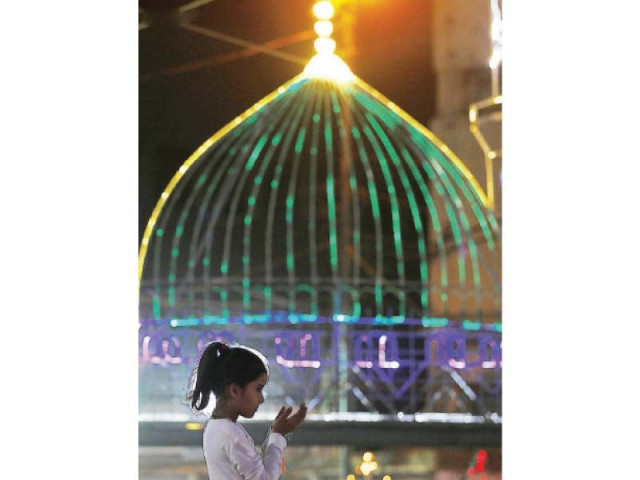 a child offers a prayer at a mosque in karachi on the eve of eid miladun nabi photo inp file a child offers a prayer at a mosque in karachi on the eve of eid miladun nabi photo inp file