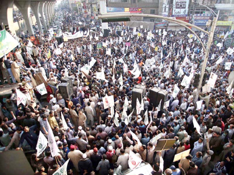 traders and shopkeepers hold a protest demonstration on murree road against the publication of blasphemous cartoon in france photo app