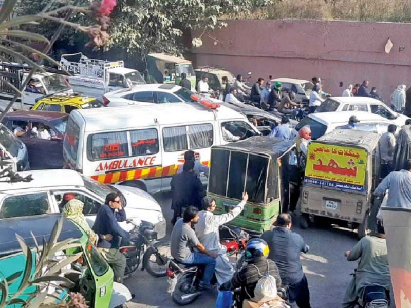 commuters are caught in a traffic jam on murree road while traffic wardens are nowhere in sight photo express file