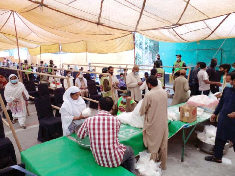 citizens line up to get sugar bags at subsidised rates photo altaf virk express