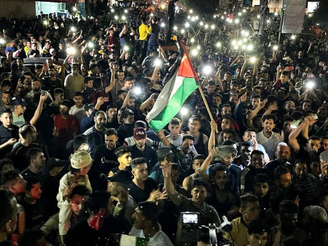 palestinians celebrate in the streets following a ceasefire in the southern gaza strip may 21 2021 photo reuters palestinians celebrate in the streets following a ceasefire in the southern gaza strip may 21 2021 photo reuters