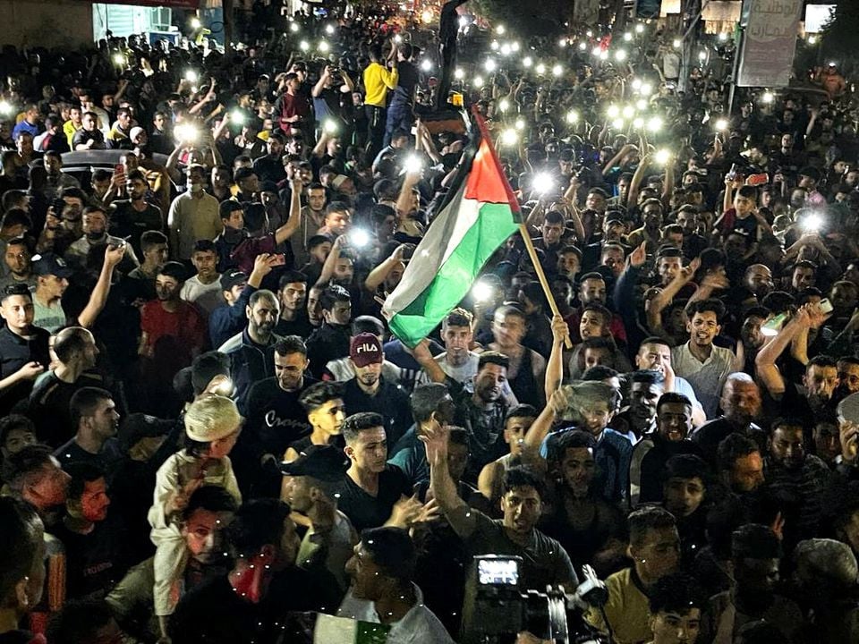 palestinians celebrate in the streets following a ceasefire in the southern gaza strip may 21 2021 photo reuters