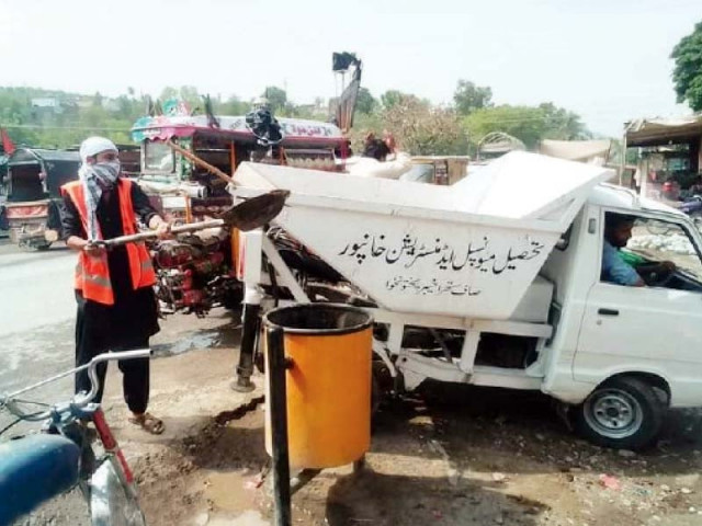 tehsil municipal administration workers are busy cleaning up at the khanpur dam photo express tehsil municipal administration workers are busy cleaning up at the khanpur dam photo express