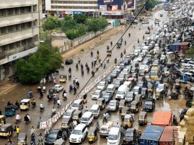 vehicles are stuck in a traffic jam on the ma jinnah road due to accumulated rainwater after a short but heavy downpour on monday photo online vehicles are stuck in a traffic jam on the ma jinnah road due to accumulated rainwater after a short but heavy downpour on monday photo online