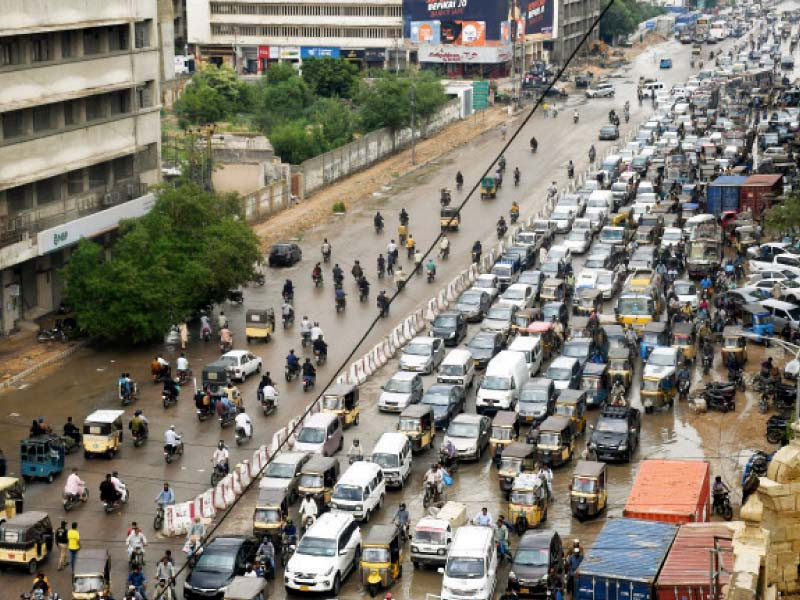 vehicles are stuck in a traffic jam on the ma jinnah road due to accumulated rainwater after a short but heavy downpour on monday photo online