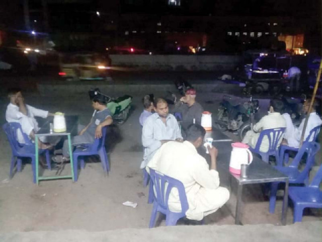 people enjoying tea at a roadside tea stall face threat of contracting dengue fever which is caused by mosquito bite photo jalal qureshi express