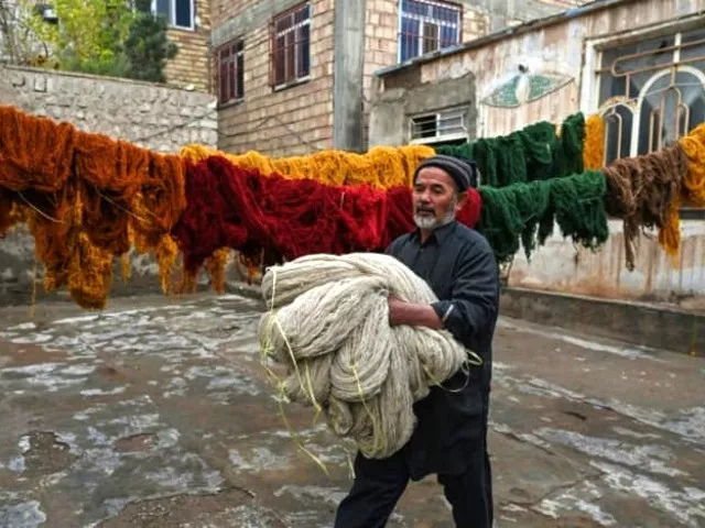afghan families go back to making carpets as economy unravels afghan families go back to making carpets as economy unravels