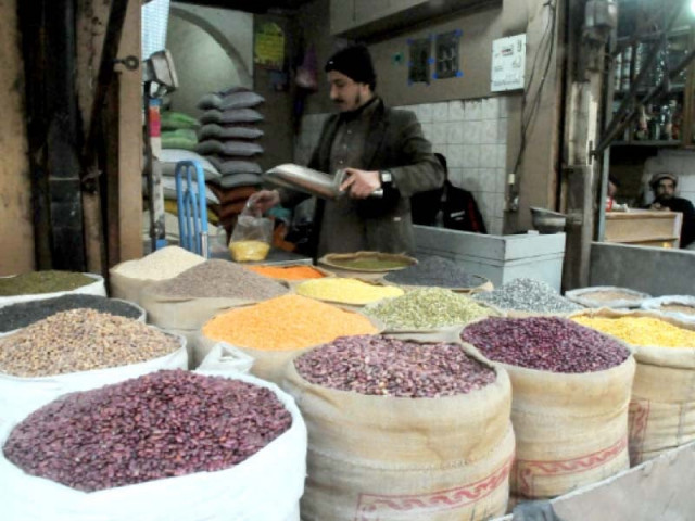 a shopkeeper sells pulses lentils beans etc at his shop in the ancient dalgaran bazaar photo agha mahroz express a shopkeeper sells pulses lentils beans etc at his shop in the ancient dalgaran bazaar photo agha mahroz express