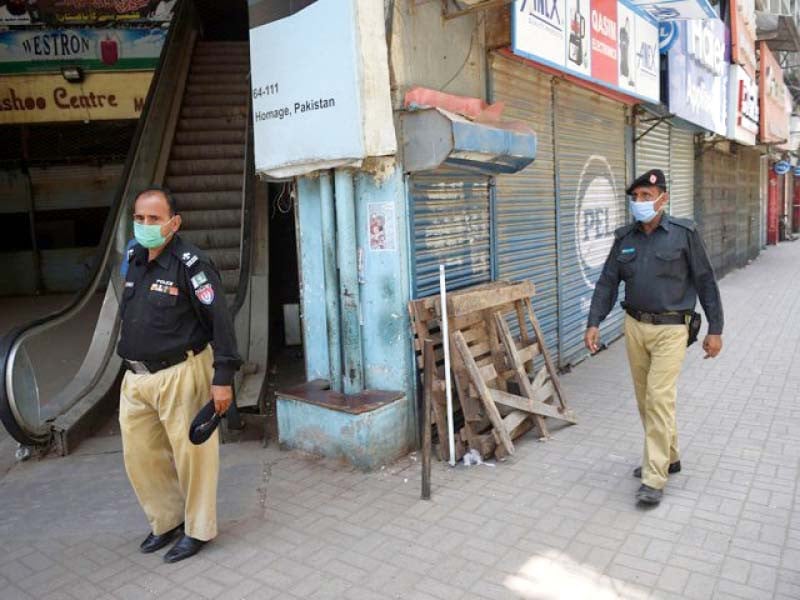 policemen patrol a market in federal b area during the micro smart lockdown which was imposed in four towns of the city in january photo file