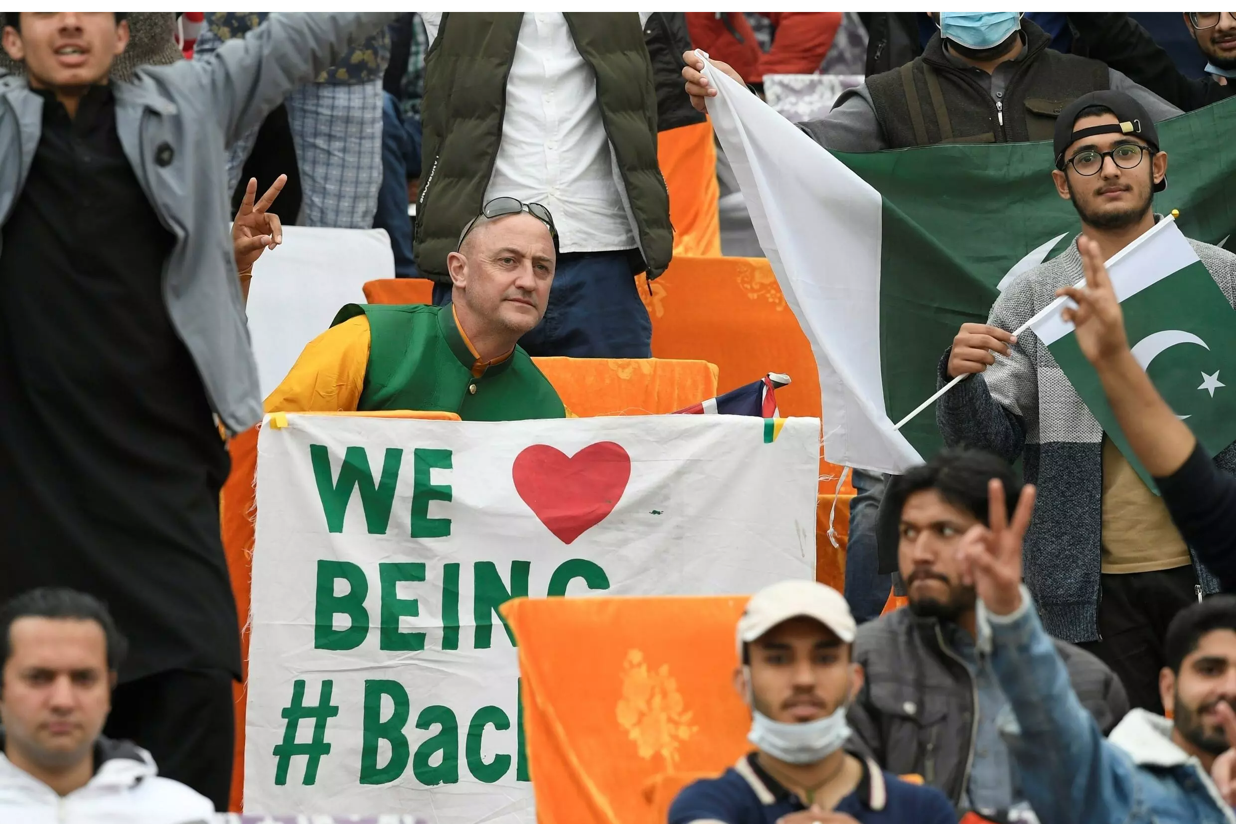 Loving being back: Australian cricket fan Luke Gillian sends a message from the stands during the first Test in Rawalpindi. AFP