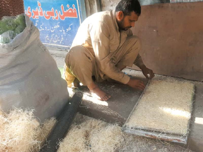 a worker is assembling an air cooler at a manufacturing shop in rawalpindi photos express