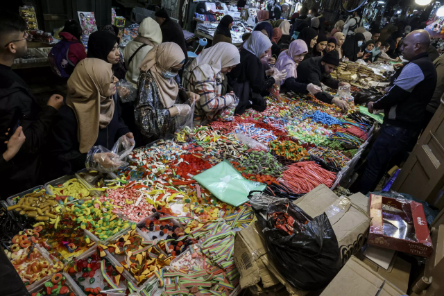 palestinians shop for sweets in the old city of jerusalem as they prepare for the start of the muslim holy fasting month of ramadan afp palestinians shop for sweets in the old city of jerusalem as they prepare for the start of the muslim holy fasting month of ramadan afp