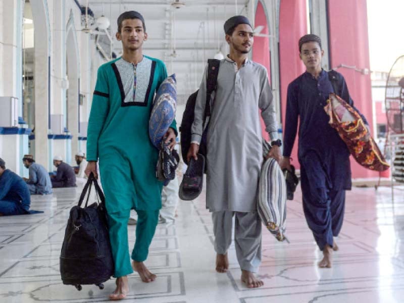 young men come to sit in aetkaf for 10 days at the new memon mosque in karachi photo afp