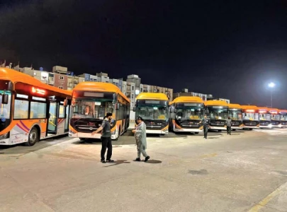 orange line buses arrive at bus terminal