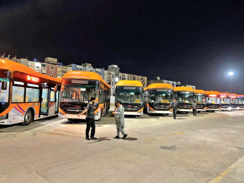 orange line buses arrive at bus terminal