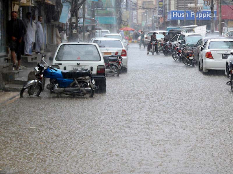 a heavy downpour lashes the provincial capital submerging roads and inconveniencing commuters photo inp