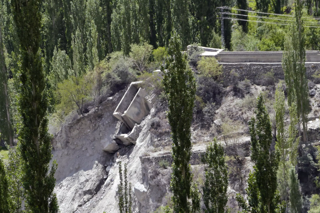 two small hydro plants were washed away in the flood that struck hassanabad afp