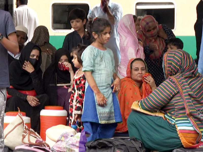 people wait for train on a platform at the karachi cantt railway station on thursday photo express