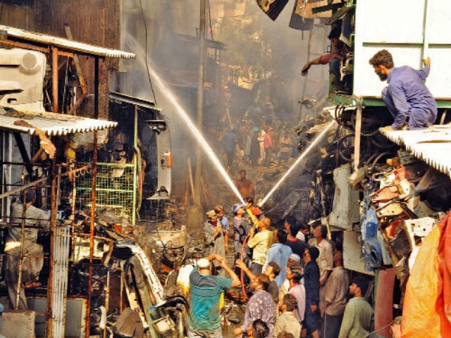firefighters struggle to douse flames after a fire broke out in shershah junk market on thursday morning photo online firefighters struggle to douse flames after a fire broke out in shershah junk market on thursday morning photo online