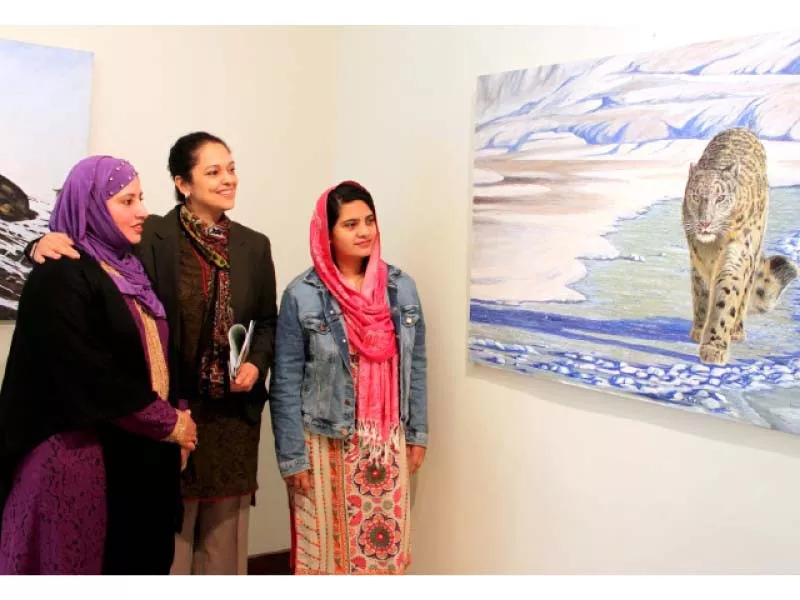 art lovers observe the painting of a snow leopard at an exhibition held at pnca to raise awareness about wildlife conservation photo express art lovers observe the painting of a snow leopard at an exhibition held at pnca to raise awareness about wildlife conservation photo express