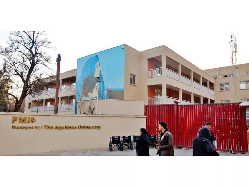 people walk past the fmic health facility in kabul which is managed by aga khan university photo express people walk past the fmic health facility in kabul which is managed by aga khan university photo express